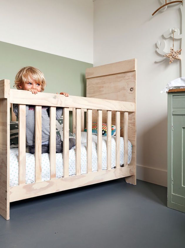 gender neutral nursery with green two tone wall